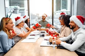 A group of people exchanging Christmas gifts