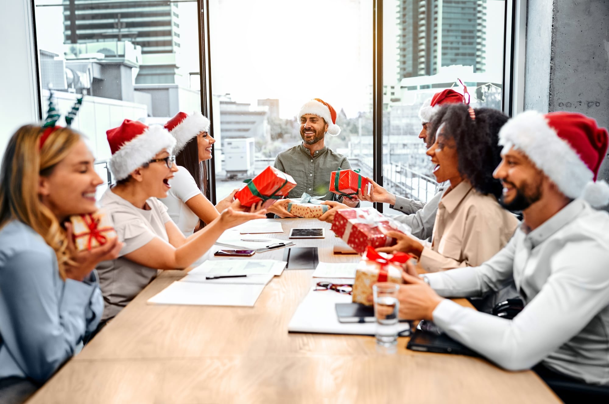 A group of people exchanging Christmas gifts